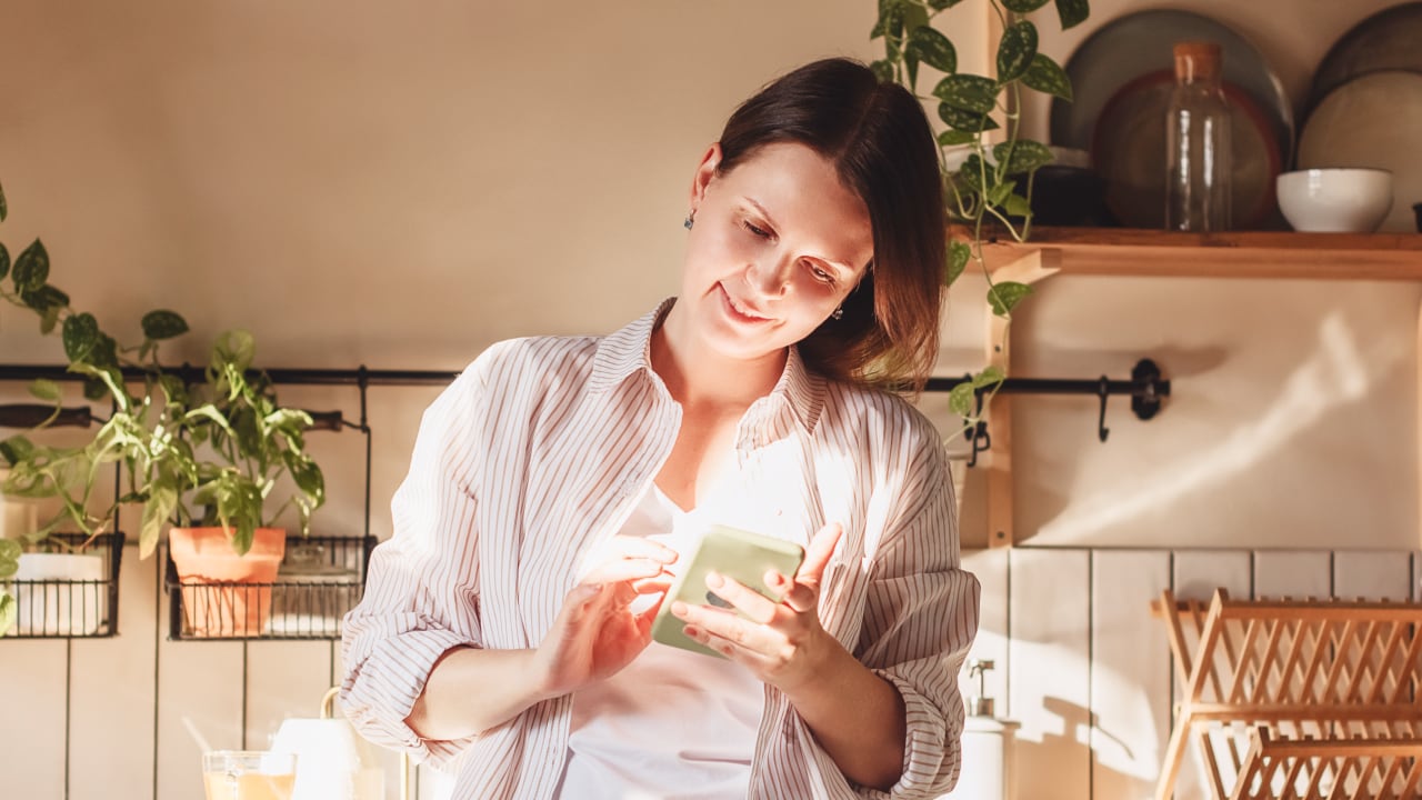 Norton promotional photograph of a person using a phone